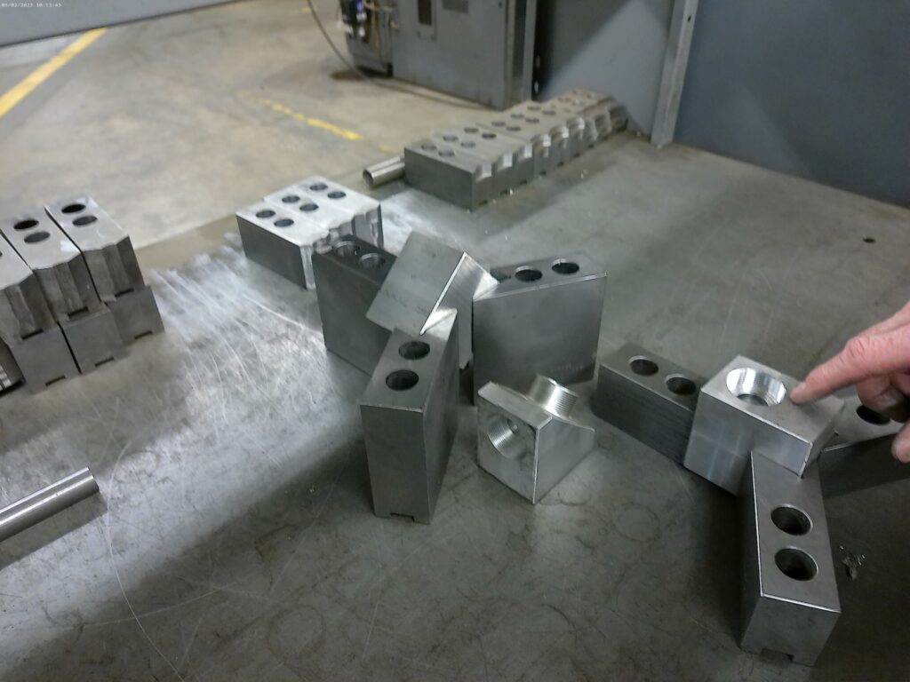 Metal blocks in jaws for fabrication.